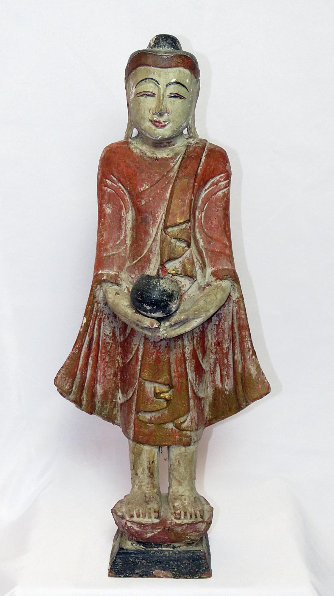 ANTIQUE CHINESE CARVED POLYCHROME BUDDHA 18TH/19TH: Antique carved and polychrome Chinese buddha. Likely 18th/19th C. Paint loss. Provenance: A NY Hamptons area estate. unsigned Measures: 23 1/2" H, 9 3/4" W, 5 5/8" D Condition: Loss to finish/polychro