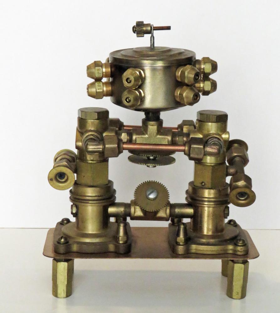 ELLSWORTH MCCOMB STEAMPUNK SCULPTURE BRASS MONSTER: Thought provoking modern sculpture by Ellsworth McComb. Mixed metal / brass Steampunk sculpture could be right off of the desk of William Gibson. Brass Nuts and Bolts. The sculpture is signed. Measure