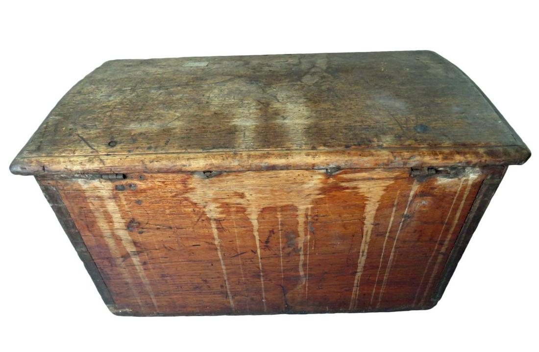 RARE 18/19 C. CAPTAINS CHEST NEW ENGLAND CARIBBEAN: A rare and early wooden seaman's / captain's chest with hand wrought iron hardware and intricate saw tooth dovetailing. Slight dome top 6 board chest. A very unusual maritime / nautical work. Likely l