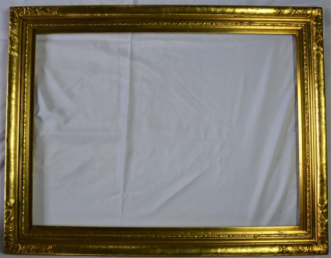 ANTIQUE NEWCOMB MACKLIN STYLE CARVED & GILT FRAME: Finely carved and gilt Newcomb Macklin style gilt frame. This frame bears a John Wanamaker (PA) label. It is a beautiful frame. It is likely late 19th or early 20th C. in construction. Measures: 28" x