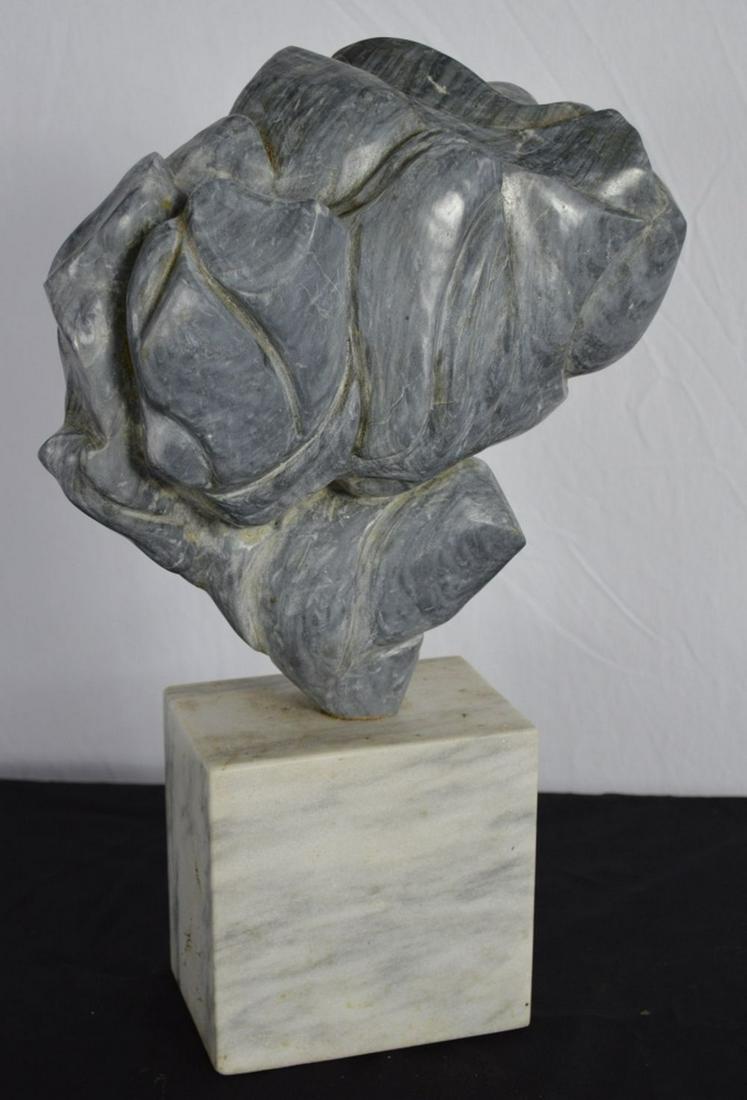 ABSTRACT MARBLE SCULPTURE GENNARELLI: Modern abstract marble sculpture on a white marble base. The work is signed A. Gennarelli. Similar to a work titled "Abstract Twirl", (see James Cox Gallery sale 9.5.10). 18" H. Total x 11 1/2" x 5". 