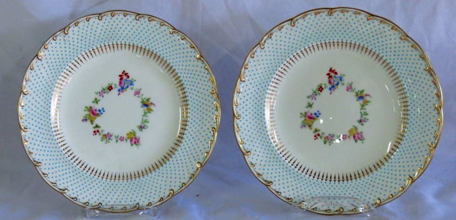 TIFFANY & CO BY MINTON FLORAL & DOT DINNER PLATES: Pair Minton plates from Tiffany in 22k gold edging and raised Robin's egg blue dots. 10" diameter.