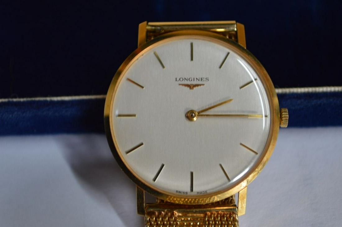 18K GOLD VINTAGE LONGINES 1041 MENS WATCH 14K BAND: Rare, vintage, manual, mechanical Longines men's wrist watch. The case is 18K gold and the band is 14K. The watch has a 17 Jewel 428 Calibre manual movement, and is the Longines 1041 model. Case measu