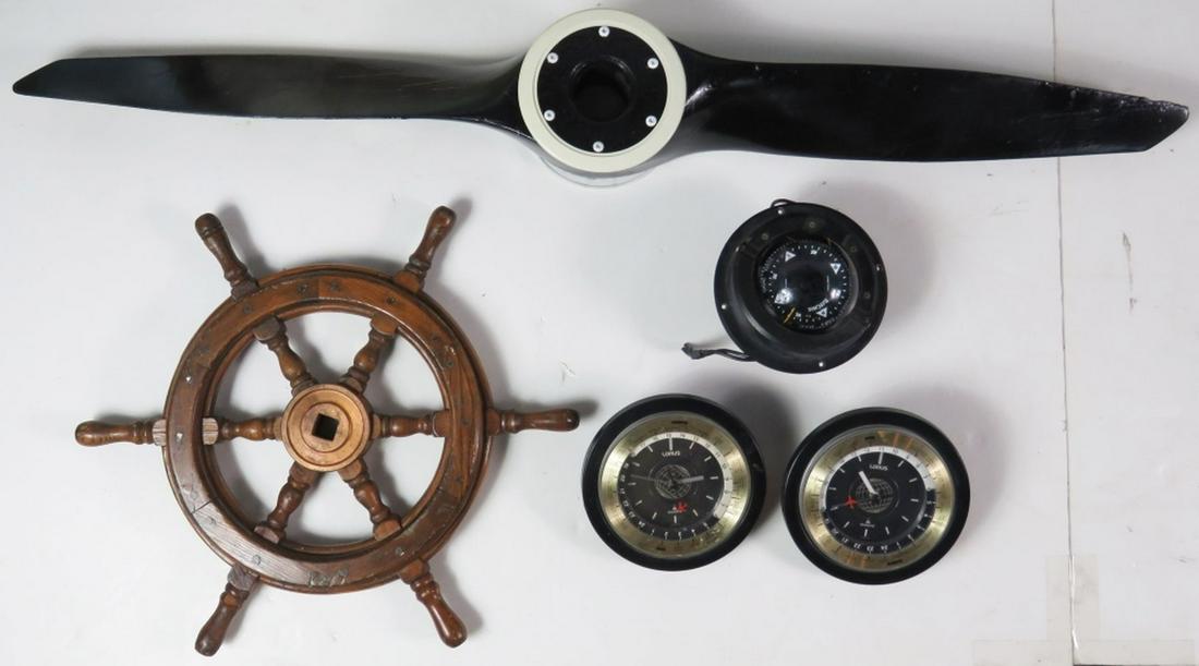 MARINE & AIRPLANE DECORATIVE LOT INC SEIKO LORUS: Lot of marine and airplane decorative objects including a propeller, ship's wheel, compasses, and 2 Seiko Lorus world clocks. Measures: Largest H 3 1/2" x L 42 1/2"