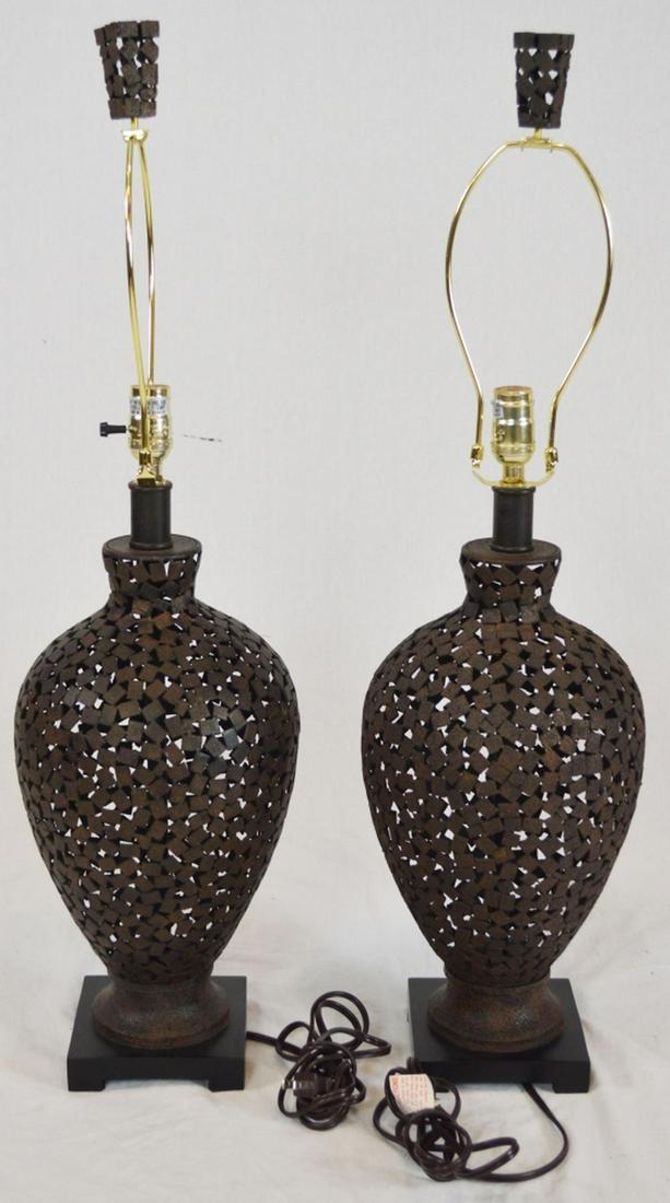 PAIR MODERN BRUTALIST PIERCED CUTOUT METAL LAMPS: A pair of designer modern cutout metal lamps. Done in an almost brutalist manner. Measures: H 23" D 10" Provenance: Property of a C-level biotech executive. NOTE: THIS LOT AND LOTS 1-200 ARE REQUIRED
