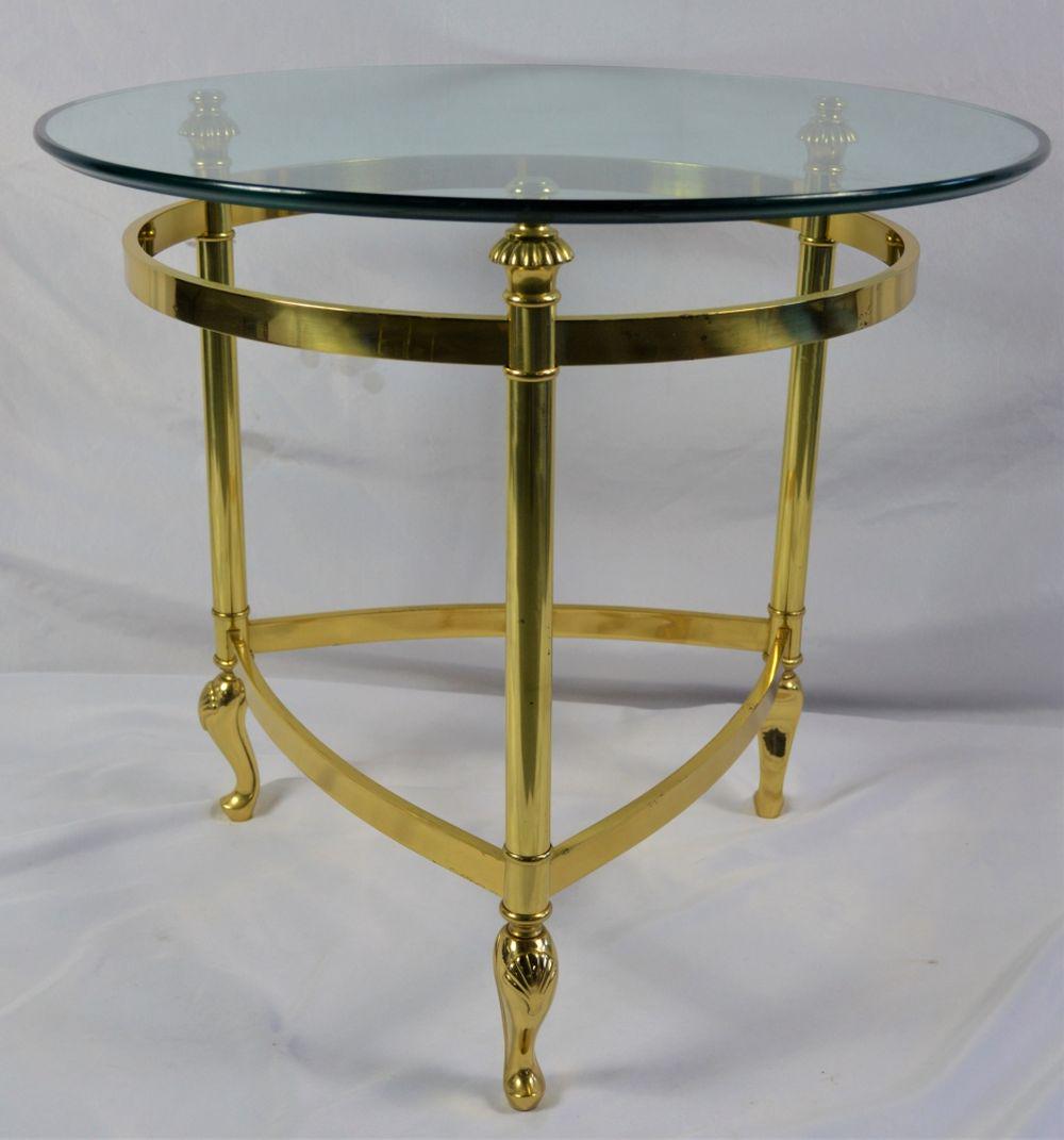MAISON JANSEN STYLE BRASS TABLE W GLASS TOP: Jensen style brass triangular based side table with a beveled plate glass top and figured feet. Good modern design with a classic twist. There are no labels/signatures on the table. Measures: 22 1/4"