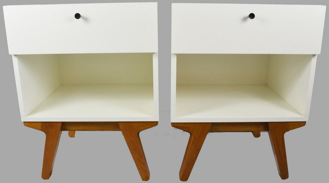 PAIR WEST ELM WHITE & TEAK MODERN SIDE TABLES: A pair of West Elm white and teak wood base side tables. The tables are of modern / late mid century design and are signed / labeled. Measures: H 26 1/2" x W 20" x D 17 1/4"