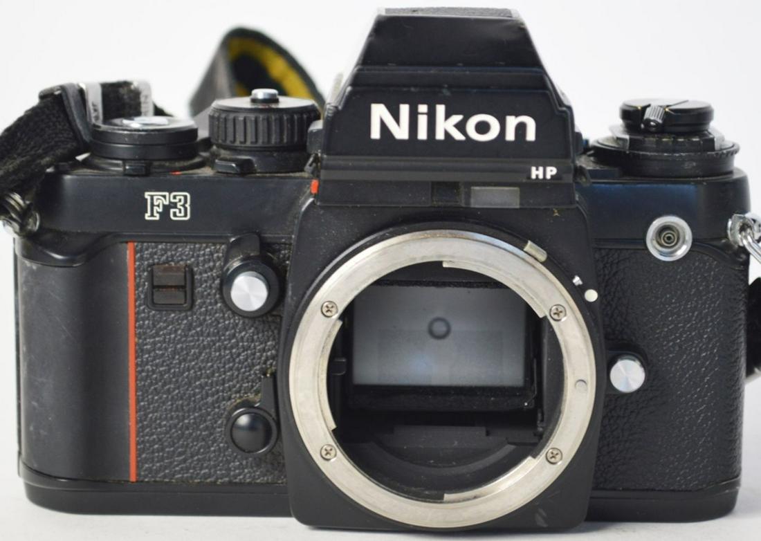 NIKON F3 SLR 35MM CAMERA BODY: A professional Nikon F3 35mm SLR camera body. Measures: H 4" x W 5 3/4" x D 3 3/4" #1736139 Provenance: From the estate collection of John Stage. Mr. Stage was a well regarded and widely known photojo