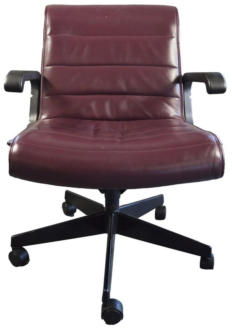KNOLL LEATHER RICHARD SAPPER CHAIR: A Knoll plum leather Richard Sapper (1932-2015) designed (1979) office chair. An iconic design seen in multiple films/videos (see Stepford Wives among others). Measures: H 34" (adjustable) x W 24" x L