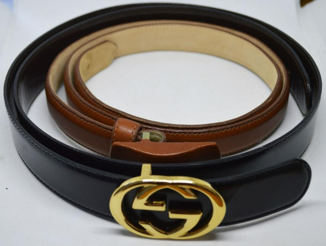 GUCCI AND ROBERT LEE MORRIS BELTS: Two leather belts. One Gucci and the other by Robert Lee Morris. Both signed and genuine. Measures: Largest L 39" x W 1 1/4"