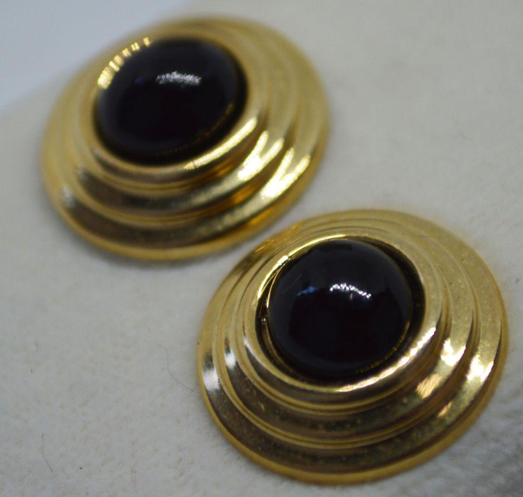 14K GOLD CIRCULAR EARRINGS: A pair of 14k gold (marked / stamped) and onyx earrings. In original box. Gross Weight: 2.46 grams