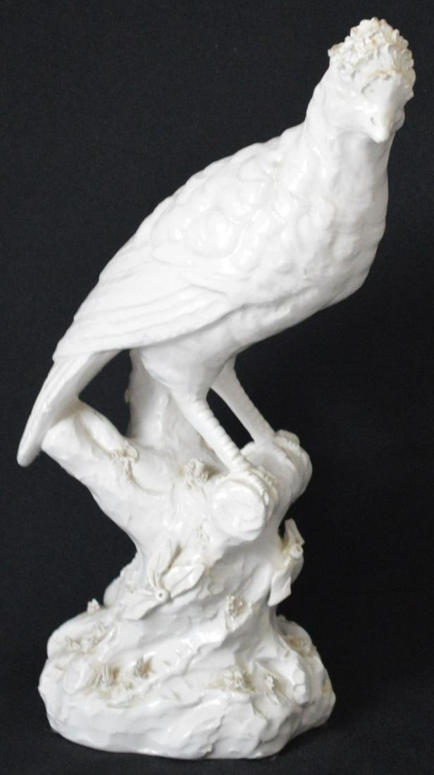 MOTTAHEDEH PORCELAIN PARROT: Mottahedeh design blanc di chine parrot Measures: H 11" x W 4 1/2" x D 4 1/2" Provenance: Property of a very well known TV/Film family.
