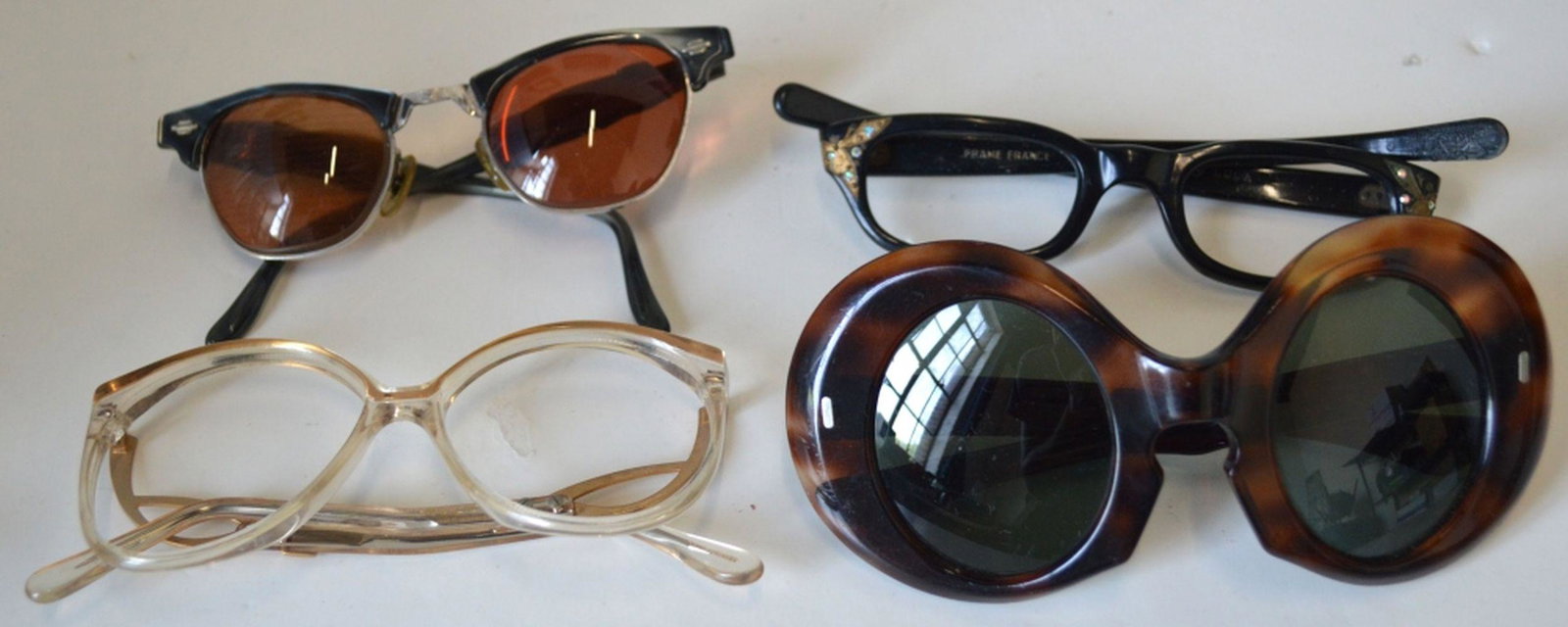 4 VINTAGE EYE / SUNGLASSES 2 MADE FRANCE ARTCRAFT: 4 pairs of vintage women's fashion sunglasses / eyeglasses. 2 pair marked as "Made in France", one pair (cateye) Artcraft with 1/10 12K Gold Filled marke to bridge. Note the large sunglasses are marke