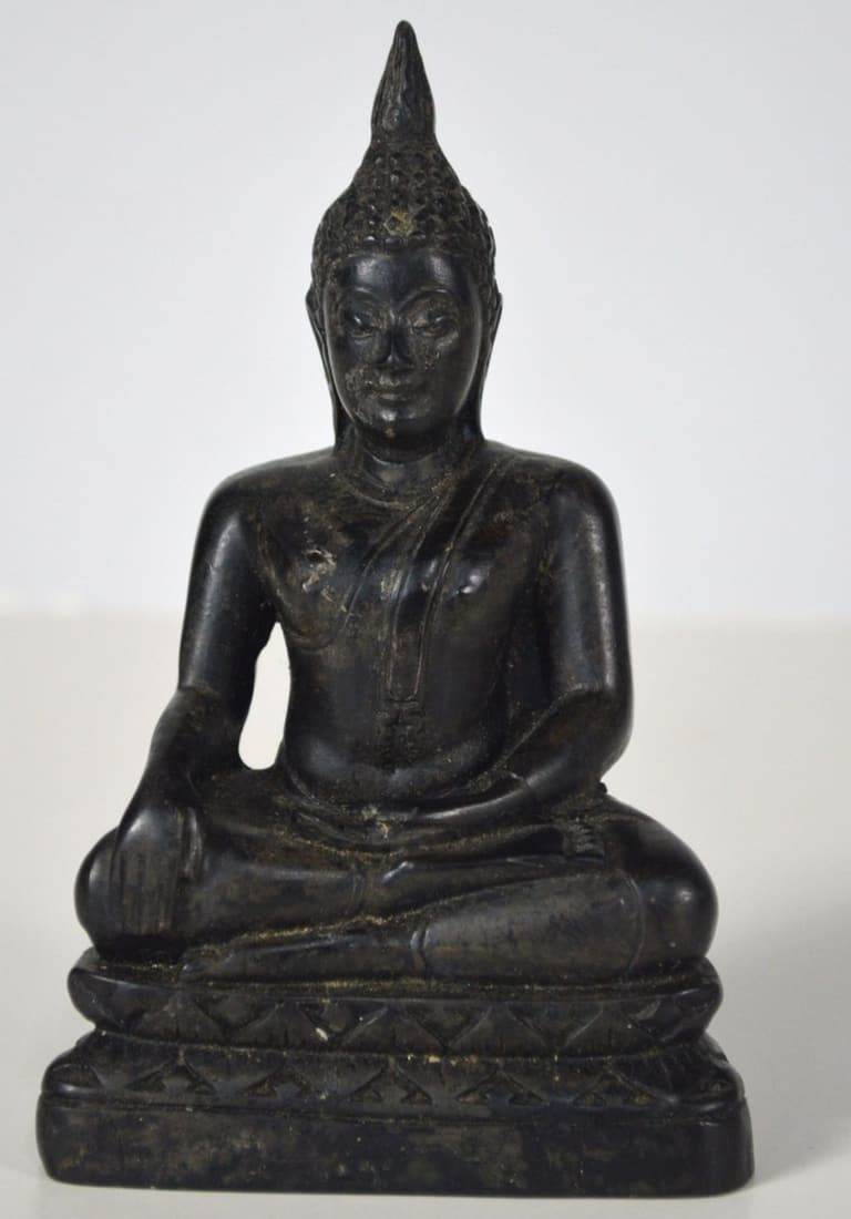 EBONY COLORED SEATED BUDDHA: A small ebony colored Buddha in a seated lotus type position. Measures: H 5 1/2" x W 3 1/4" x D 2"