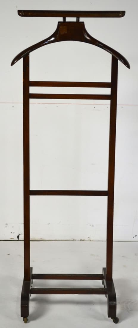 ANTIQUE MAHOGANY VALET ON CASTERS: An antique/vintage clothing valet on casters. Measures: H 46 1/2" x W 18" x D 14"