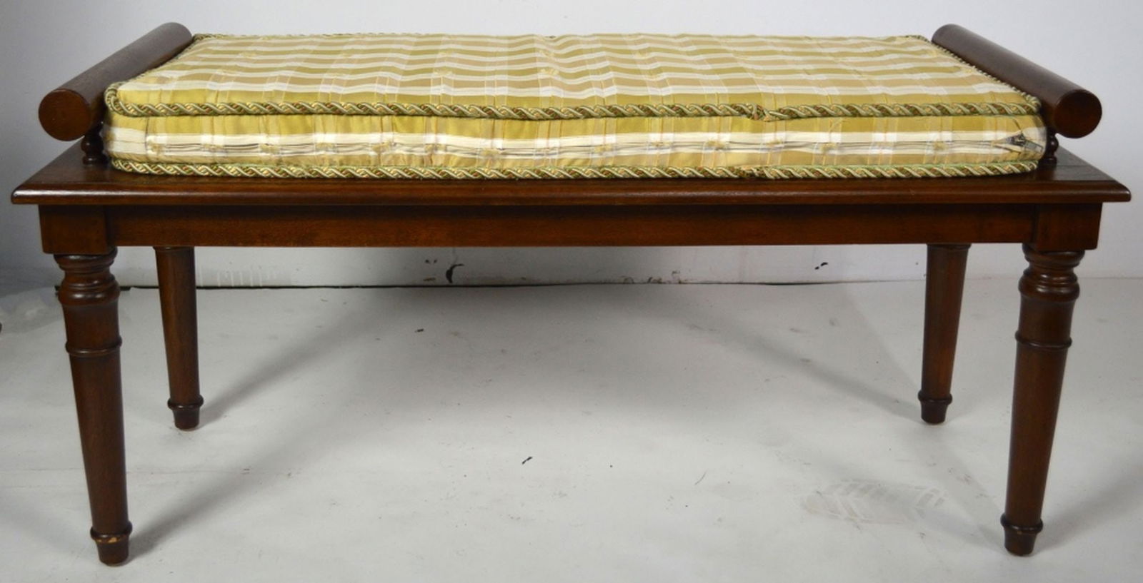 FINE ANTIQUE FIGURED BENCH W CANED / WICKER SEAT: A fine caned seat figured wooden bench with a custom cushion fashioned from fine fabric and braided cord edging. Measures: H 20 1/2" x W 42" x D 17"