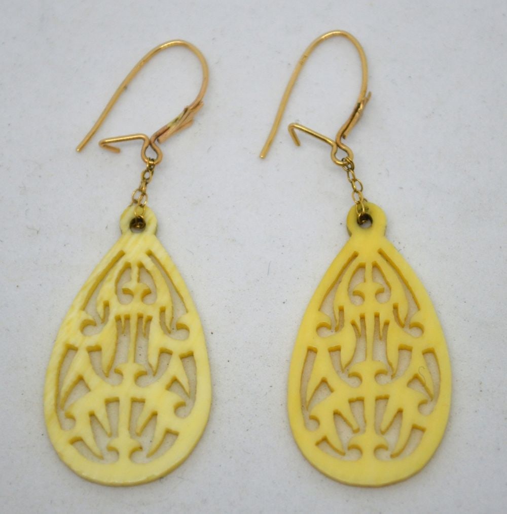 CARVED AND PIERCED EARRINGS W 14K GOLD POSTS: Finely carved and pierced bone vintage / antique earrings. Posts marked (tested) 14k. Measures: H 1" x W 1/2"
