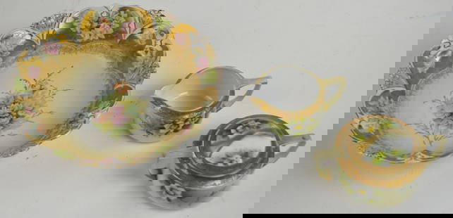 VINTAGE NIPPON FINE GILT PAINTED CHINA LOT: A lot of hand painted and gilt edged porcelain. Cream and sugar marked NIppon. The third, bowl, unmarked, possibly Limoges. Measures Largest: H 3" x Dia 10 1/4"