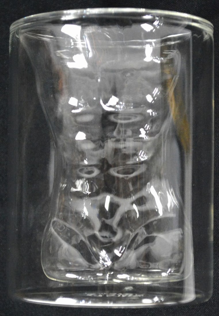 LOT 13 CRYSTAL INC NUDE MALE FIGURAL COCKTAILS: Lot 13 assorted crystal including Waterford champagne glass, male torso glasses, etc. Measures: H. 9 1/2", Dia. 7"