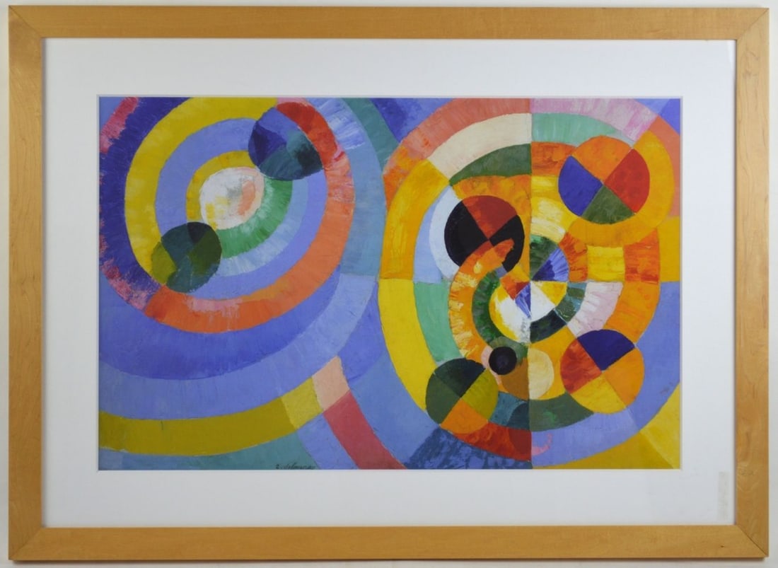 ROBERT DELAUNAY AFTER CIRCULAR FORMS PRINT: After Robert Delaunay (1885-1941 - France). A print of his well known "CIrcular Forms" work (c. 1930). The print is attractively framed in a blonde wood frame, under glass. Measures: H 28 1/4" x W 38