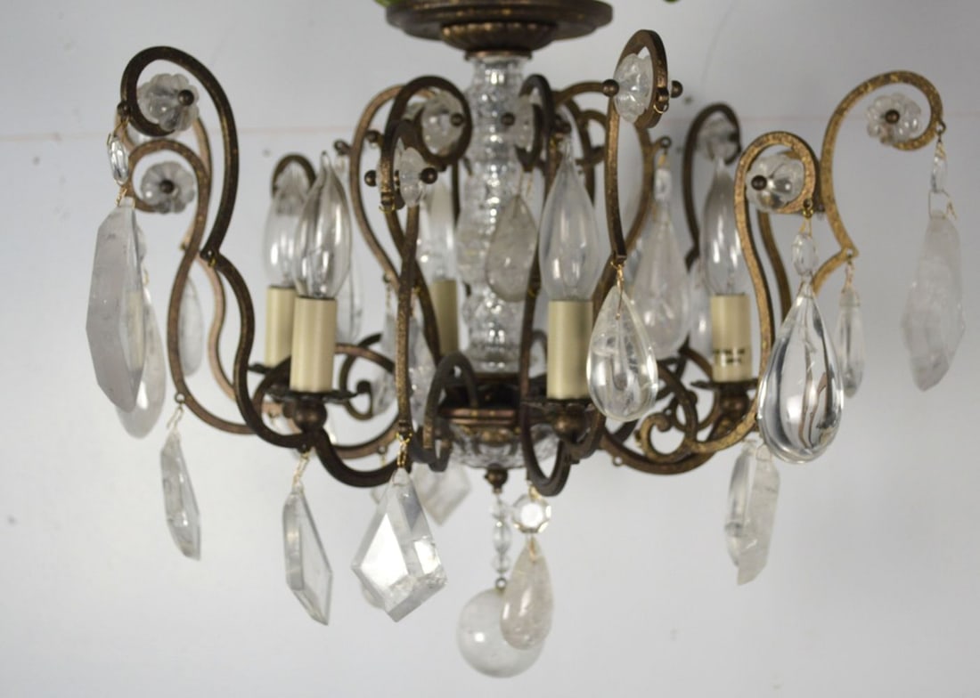 VINTAGE BRONZE FINISH METAL AND CRYSTAL CHANDELIER: A vintage lighting fixture. Fixture consists of a bronze finished metal structure with crystal pendants. It is not visibly signed. Measures: H 15" x W 20" x D 20" Provenance: Property of a Westchester