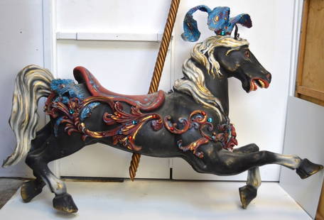 FILM / THEATRICAL PROP CAROUSEL HORSE: A custom made and hand decorated / finished prop carousel horse. Produced by a vacuum forming polymer process and then hand finished. No base Measures: H 45", W 71", D 16" Provenance: Property of a we