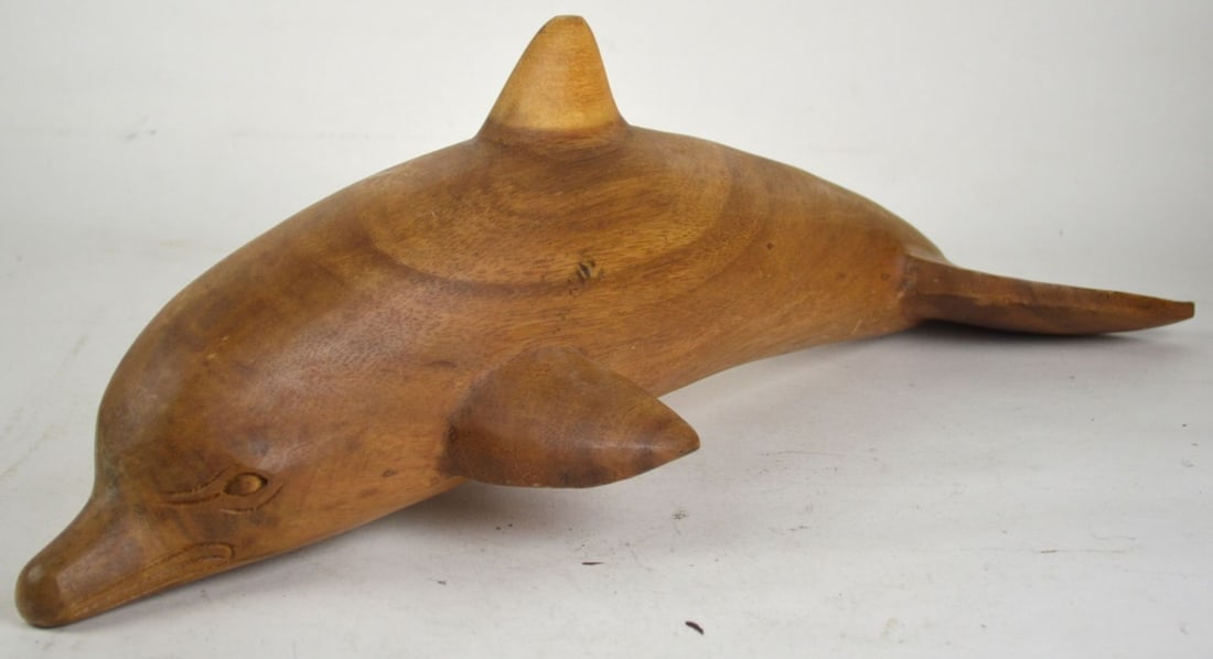 LARGE CARVED WOOD DOLPHIN SCULPTURE: A large carved wood (appears to be teak) dolphin sculpture. The work is not visibly signed. Measures: 25" x 9" x 8"