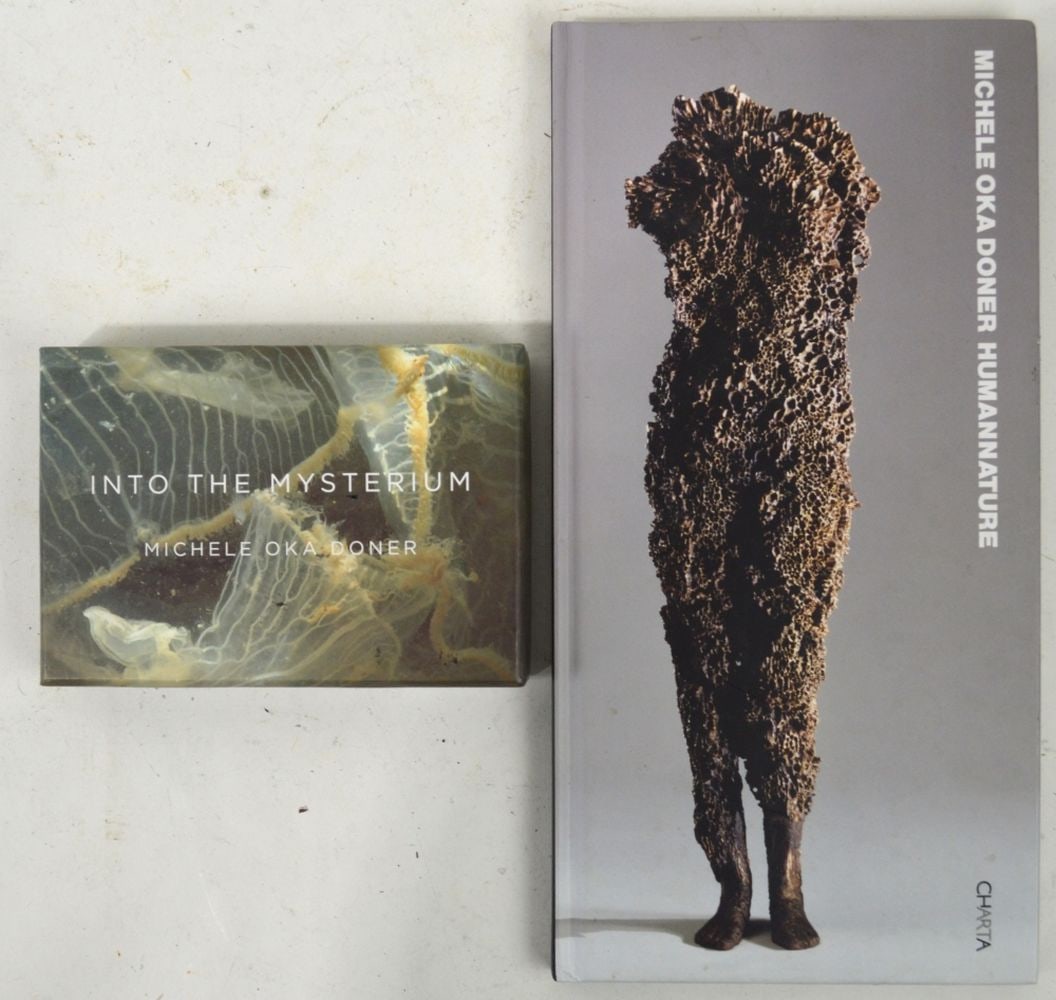 MICHELE OKA DONER BOOKS SIGNED: 2 books/publications by Michele Oka Doner of her sculptural works. The larger signed, and inscribed, by the artist. Measures: Largest 13" x 6 1/2" Provenance: Ex-Estate of Dick Polich.