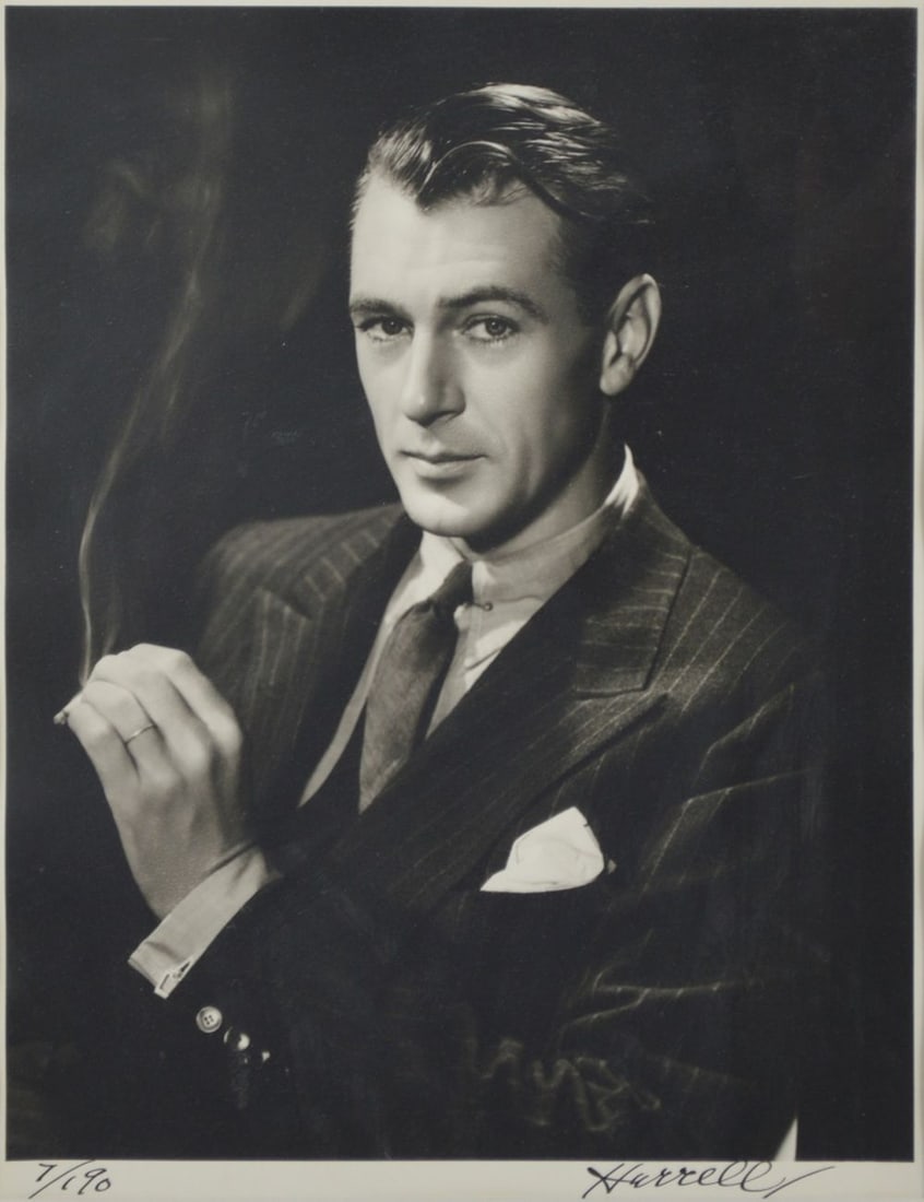 GEORGE HURRELL SIGNED PHOTOGRAPH OF GARY COOPER: George Hurrell (US 1904-1992). A photograph of Gary Cooper. Photograph is signed, and numbered, by Hurrell. It is framed, under glass, and is accompanied by a certificate of authenticity. From an edit
