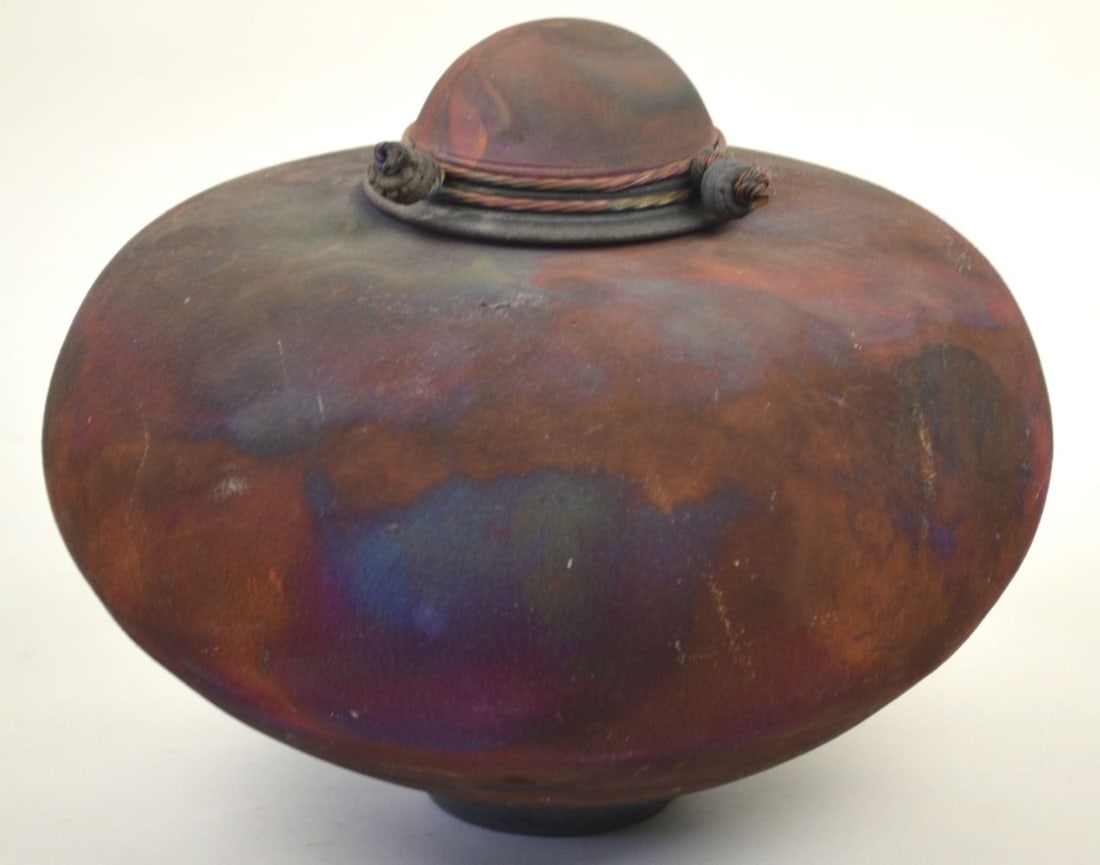 RAKU ART POTTERY W LID SIGNED: A Raku art pottery vase with lid. Signed to the base. Measures: H 9 x D 11 1/2"
