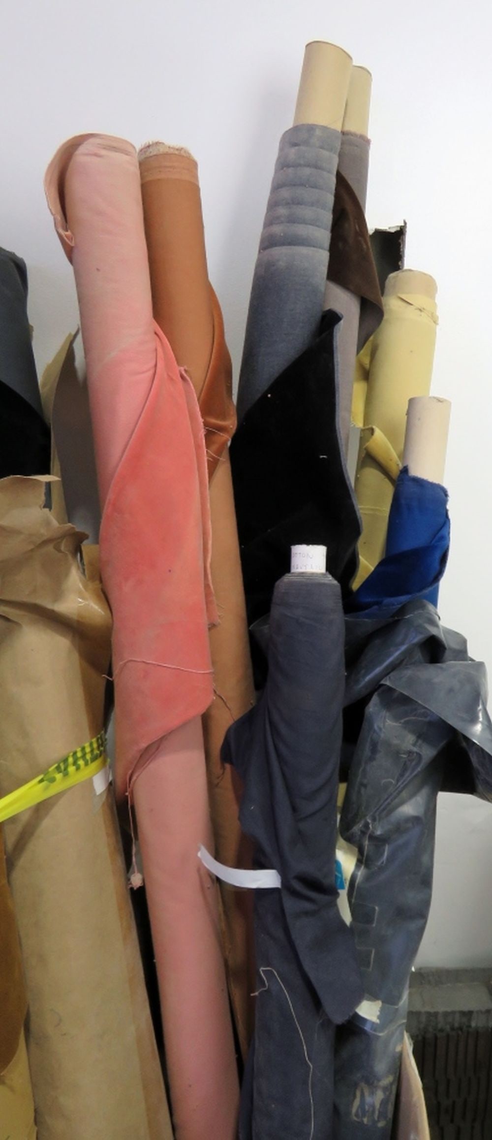 LOT OF FINE VELVET FABRIC: A lot of various colors/yardage of fine velvet fabrics. One navy cotton roll Measures: W 54"-60"