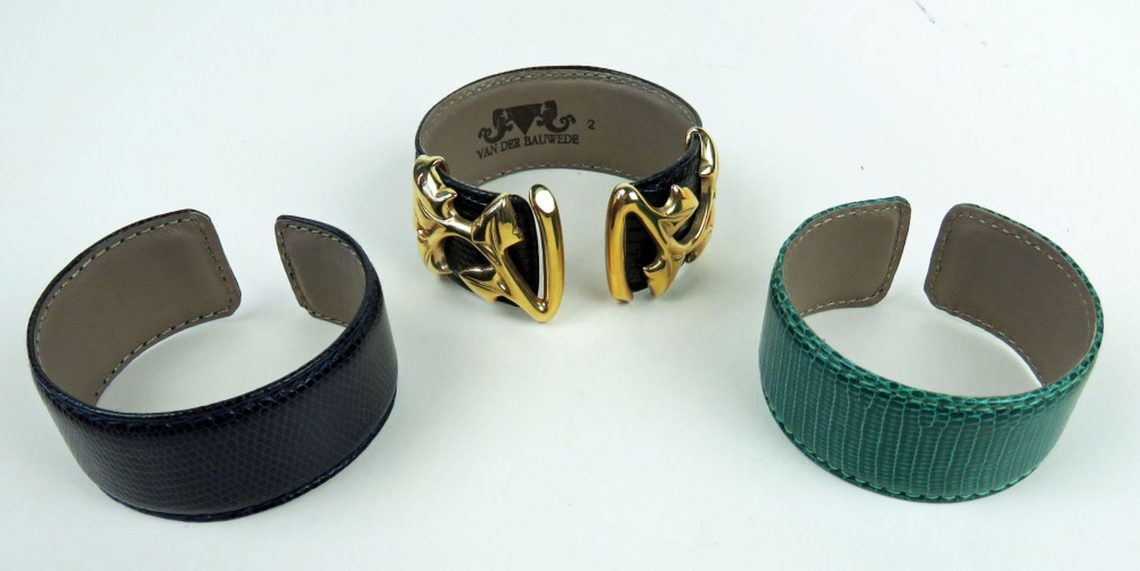 THREE (3) VAN DER BAUWEDE LEATHER CUFF BRACELETS: Three Van Der Bauwede leather cuff type bracelets. All marked/signed. Measures: each 2 1/2" x 2 3/8" x 1 1/8"