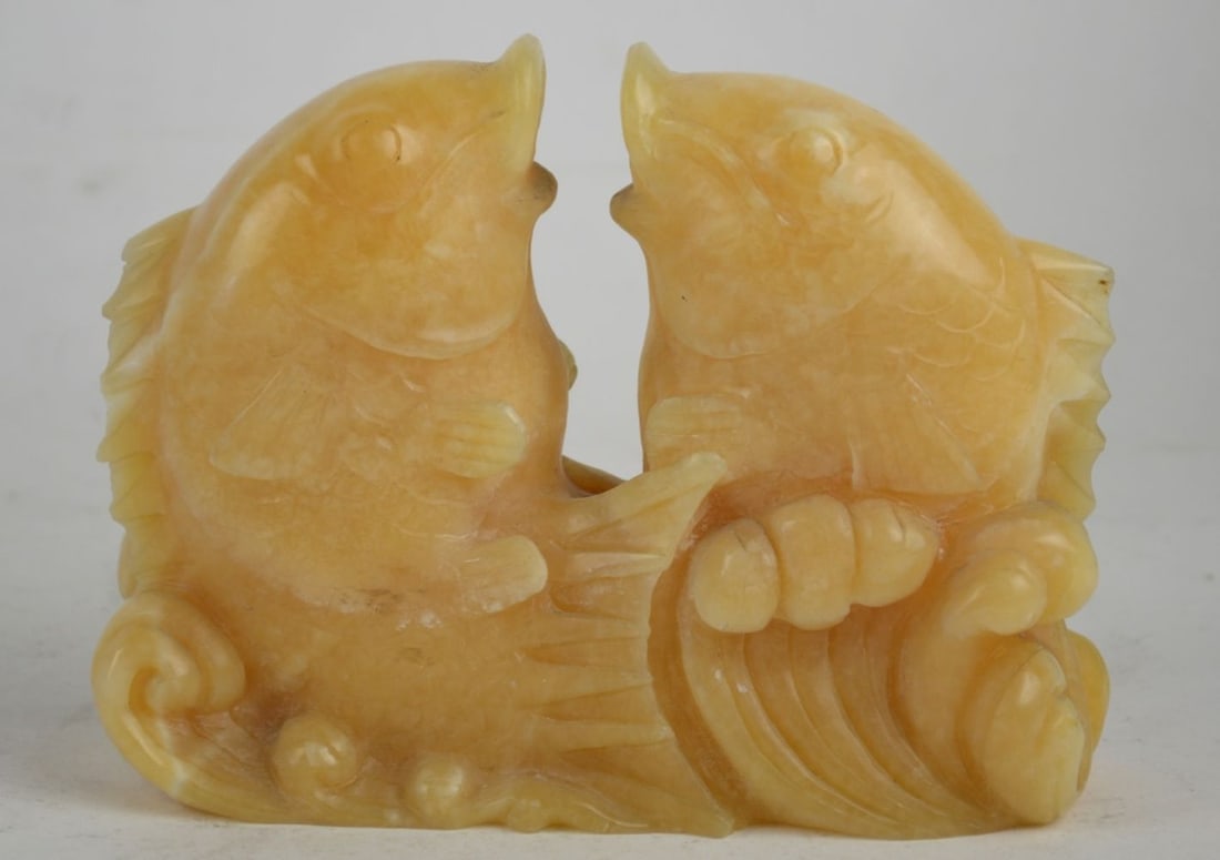 CARVED CHINESE TWIN FISH SCULPTURE: A carved yellow stone kissing carp sculpture. The work is not signed. Measures: 5 1/2" x 7" x 3"