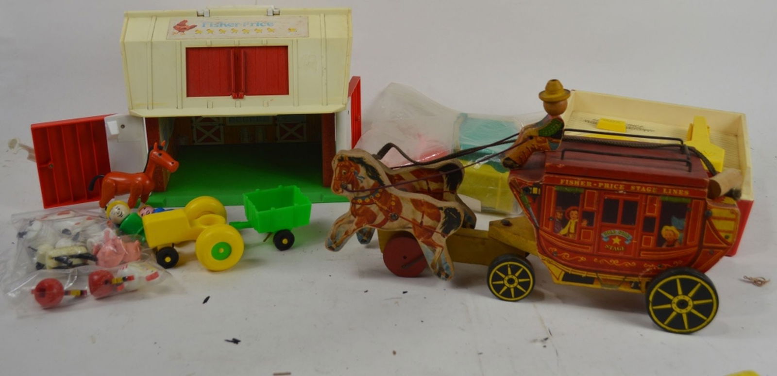 VINTAGE FISHER-PRICE TOY LOT: A lot of vintage Fisher-Price toys. Measures: Largest 9" x 11" x 7"