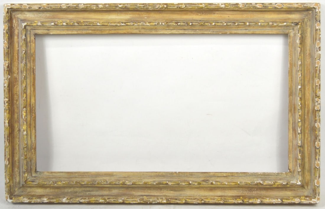 FINELY CARVED MODERNIST FRAME: A nicely carved modernist frame finished with a white gilt overlay finish. Measures: 18 1/8" x 28 1/8" Rabbet: 13 1/8" x 23 1/8"