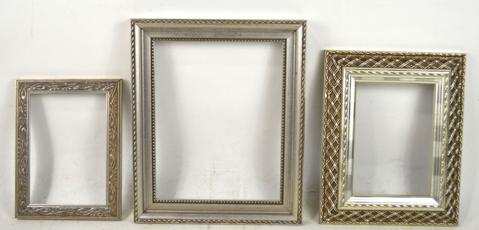 3 CONTEMPORARY SILVER FRAMES: A grouping of 3 contemporary silver finished frames. Measures: Largest 11 3/4" x 9 3/4" Rabbet: 10" x 8"