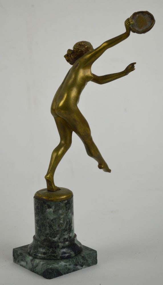 BRONZE NUDE DANCING SCULPTURE SIGNED: An antique gilded bronze nude sculpture, Circa 1925, "The Tambourine Dancer". This piece is signed, numbered and is mounted on a marble base. See Bonham's- London sale dated 18 June, 2014, Lot 50. Mea