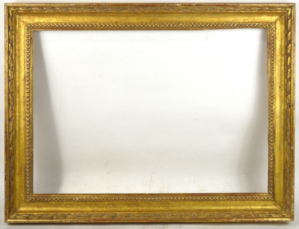 LOUIS XVI GILTWOOD FRAME: A carved and gilt Louis XVI frame by Heydenryk. Measures: 23 3/4" x 31 1/2" Rabbet: 18 1/2" x 26 1/4"