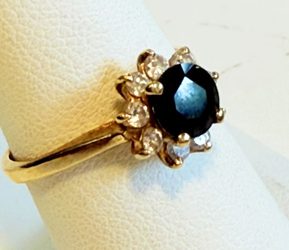 VINTAGE 14K GOLD SAPPHIRE AND DIAMOND RING: Vintage 14K Gold sapphire ring (.2 carat - chip to stone) with 9 pronged accent diamonds 20 pts. 2.39 Grams Measures: Size 7.25