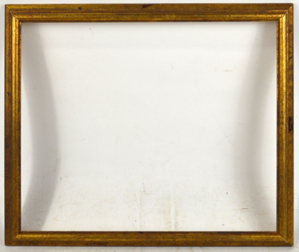 RECEDING EDGE TRADITIONAL FRAME: A receding edge reverse cove gold frame. Measures: 16 3/4" x 14 5/8" Rabbet: 15" x 12 7/8"