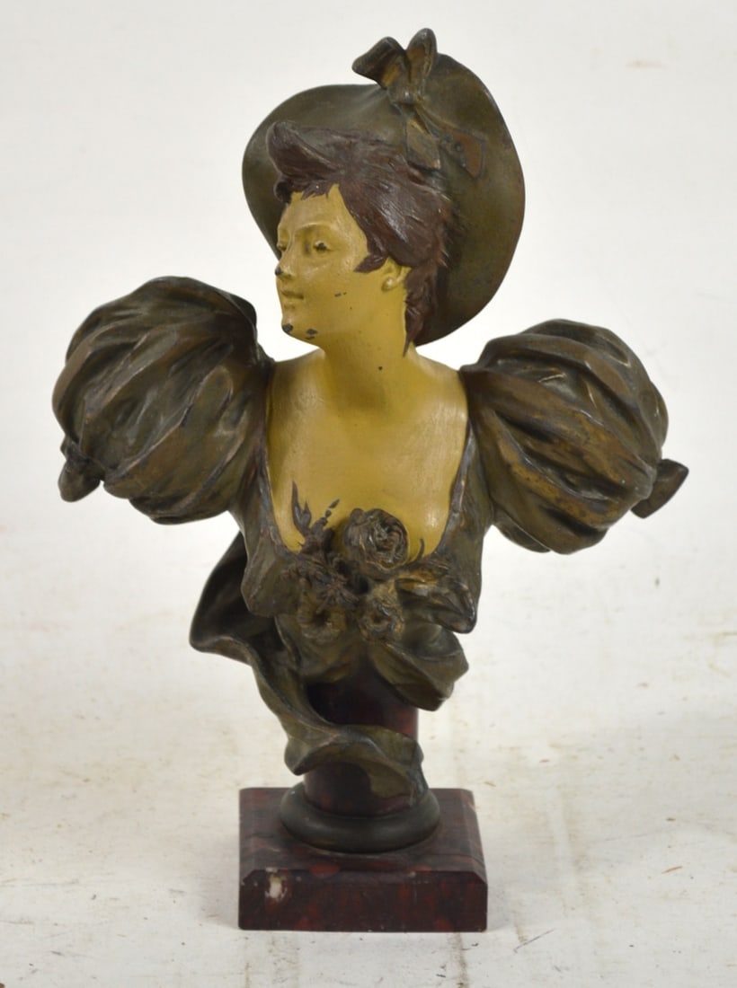 FRENCH ART NOUVEAU WOMAN BRONZE SCULPTURE: A French art nouveau cold painted bronze sculpture of a beautiful woman in period dress, Note the butterfly and floral relief detail on the front. Mounted on a red marble plinth. The work is not visib
