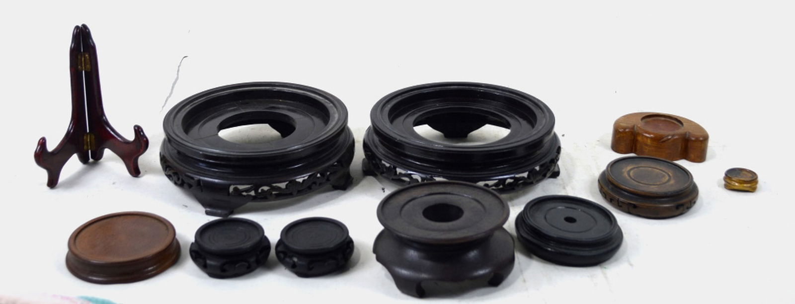 GROUP CHINESE / JAPANESE ROSEWOOD DISPLAY STANDS: Group of rosewood and teak Chinese & Japanese display stands. Measures: Largest 8" x 8" x 2 1/2"