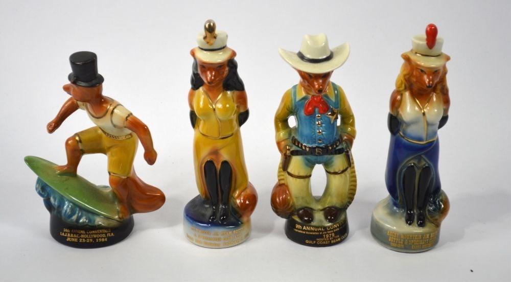 4 JIM BEAM REGAL CHINA CHARACTER BOTTLES: A group of 4 Jim Beam Regal China porcelain figures. Dated as follows: 1 x 1978 2 x 1979 1 x 1984 Measures: 8" x 2 1/2" x 2 1/2"