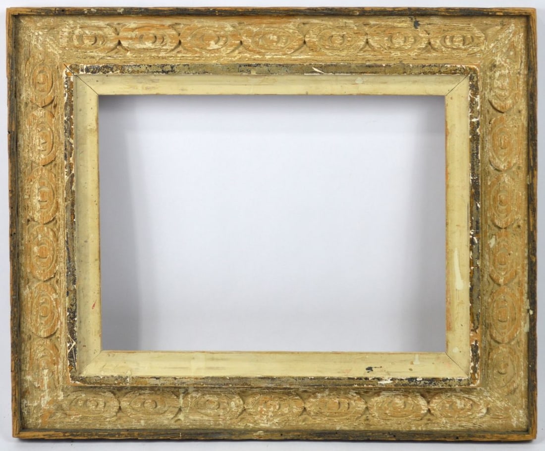 FINE CARVED HEYDENRYK AMERICAN MODERNIST FRAME: A finely executed carved American modernist frame from Heydenryk. A cassetta panel is carved with benin/archaic Greek motifs and finished with gesso scumbling. A giltwood inner border completes