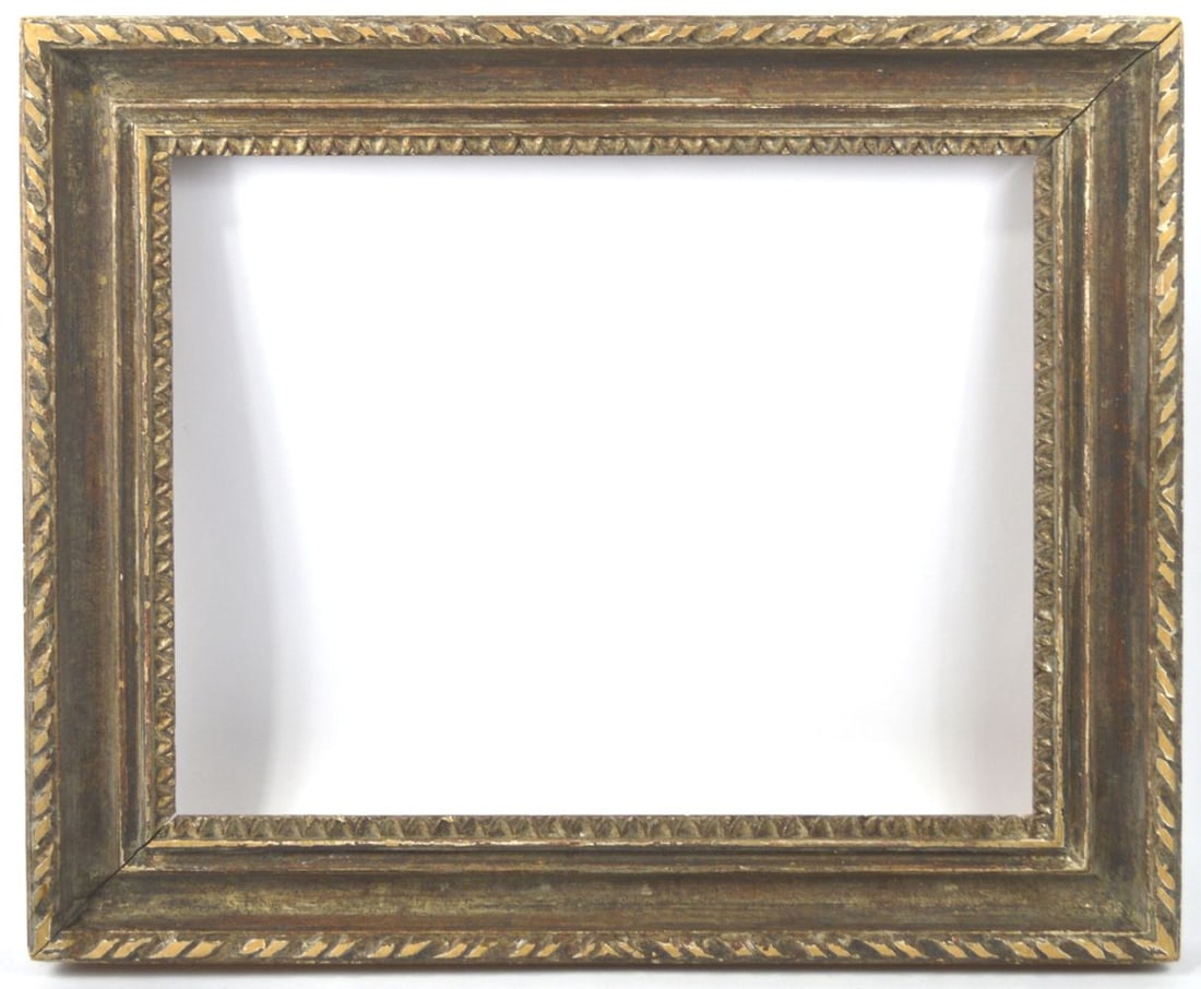 CLASSIC ITALIAN GALLERY FRAME BY HEYDENRYK: A classic scoop cove gallery frame by Heydenryk (label verso) based on the 18th C. Italian original. Carved with a good dusky silver gilt finish. Measures: 26 1/8" x 22 1/8" Rabbet: 20 3/8" x 16 3/8"