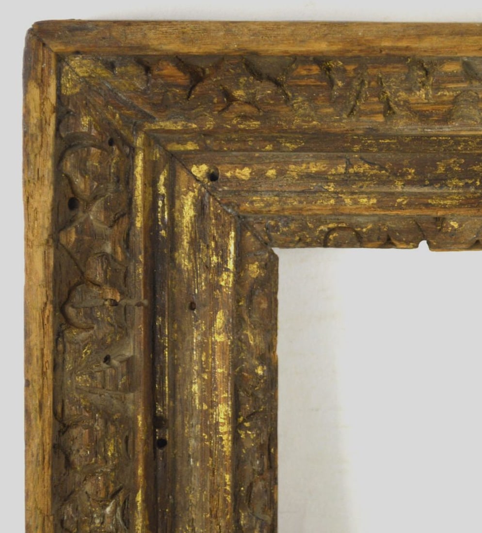FINELY CARVED SPANISH FRAME 16X20: A very finely carved and parcel gilt wormy chestnut Spanish frame from Heydenryk. . Measures: 24" x 20" Rabbet: 20 3/8" x 16 3/8"