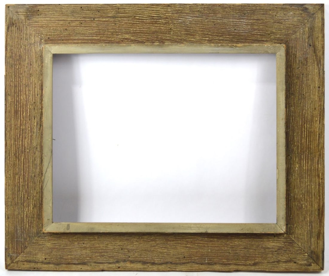 HEYDENRYK MODERNIST WIDE WORMY CHESTNUT FRAME: A House of Heydenryk (label verso) wormy chestnut American modernist frame. Wide striated frame with a raised inner border. Measures: 28" x 23 1/4" Rabbet: 20 1/4" x 15 1/4"