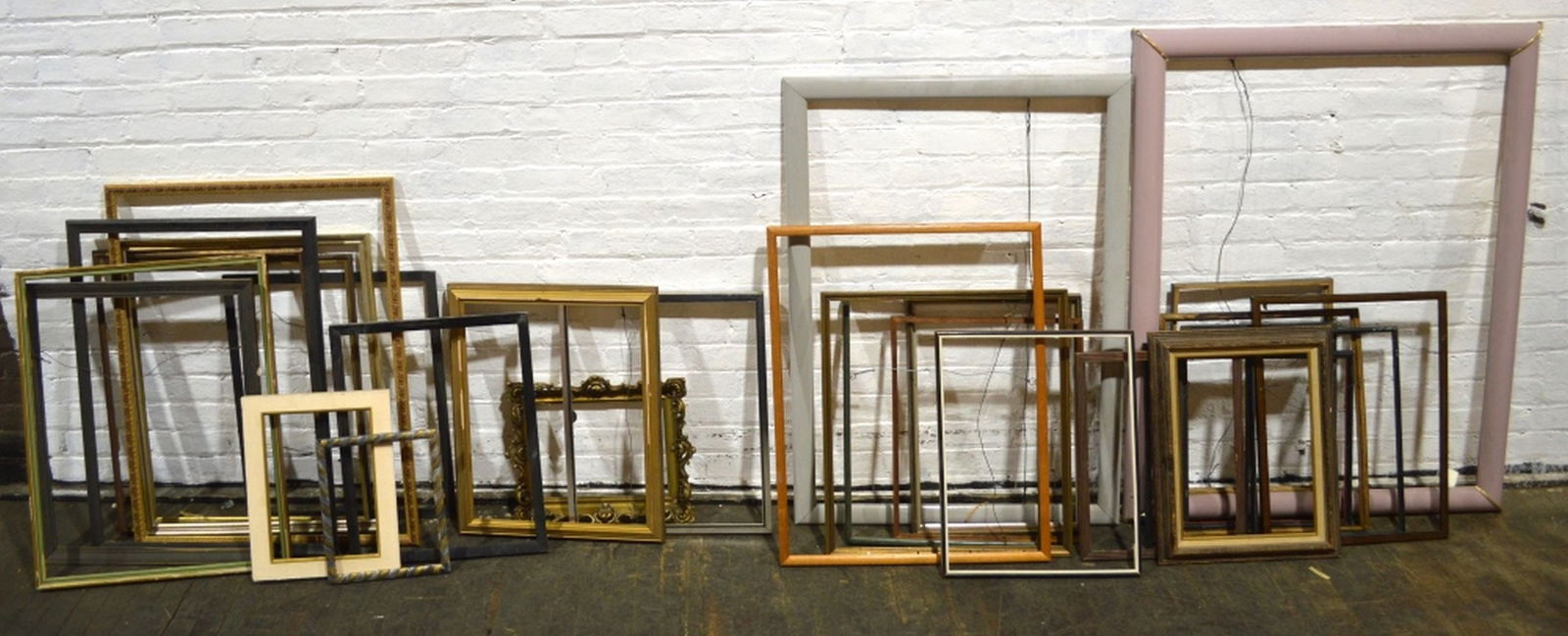 LARGE GROUP OF FRAMES: A large grouping of frames. Largest 45" x 35" over 25+ frames