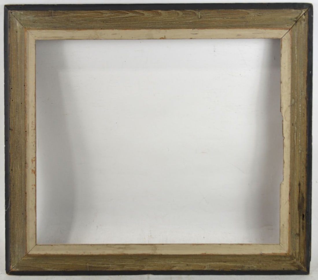 AMERICAN MODERNIST WORMY CHESTNUT FRAME: An American modernist reverse / receding cove frame. Matte black exterior edge and smoky white inner edge. Measures: 27 1/2" x 23 1/2" Rabbet: 22 1/8" x 18 1/8"
