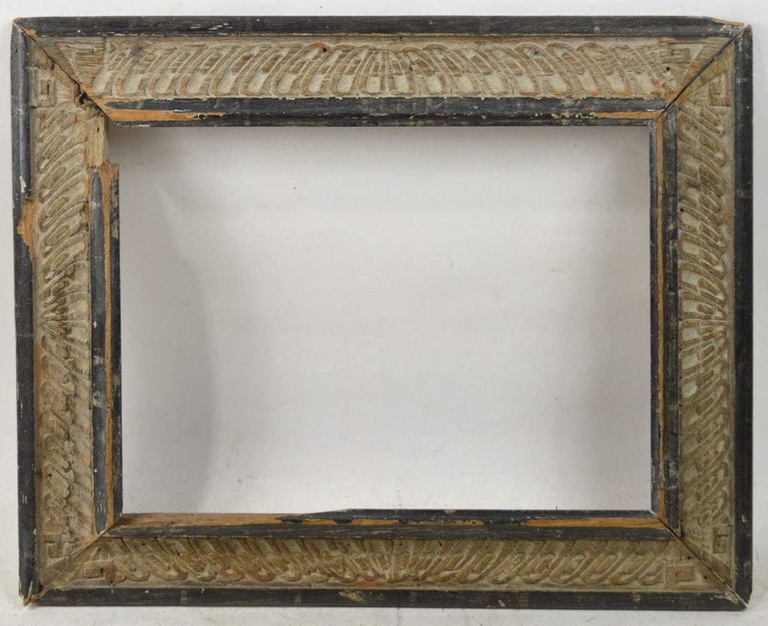 HEYDENRYK CARVED MODERNIST FRAME: A Heydenryk original frame (label verso) with an ancient Chinese design carved in the reverse cove panel and bordered by an ebonized outer and inner border. A unique design. Measures: 22 1/4" x